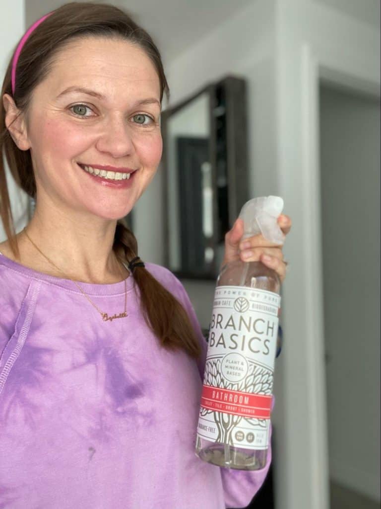 Izabella Wentz holding a bottle of Branch Basics